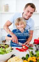 Cheerful father and his son cooking