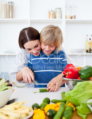 Happy mother and her son cooking