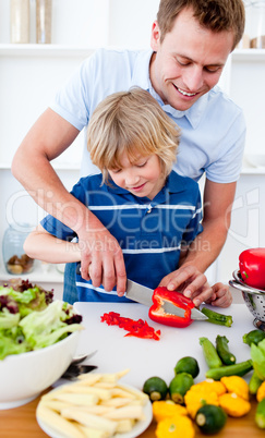 Jolly father and his son cooking