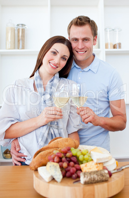 Happy couple drinking white wine