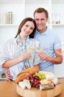 Happy couple drinking white wine