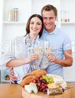 Smiling lovers drinking white wine