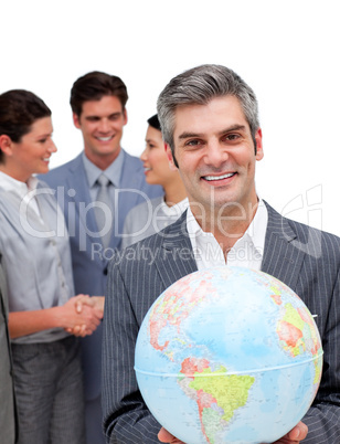 Ambitious manager and his team holding a terrestrial globe