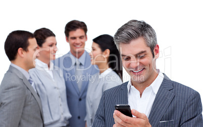 Enthusiastic businessman and his cellphone standing apart from h