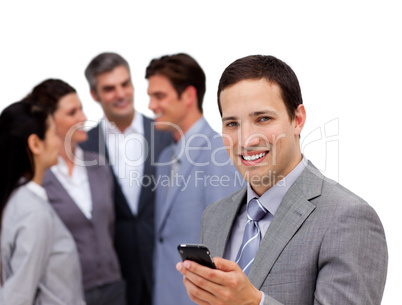 Confident businessman and his cellphone standing apart from his