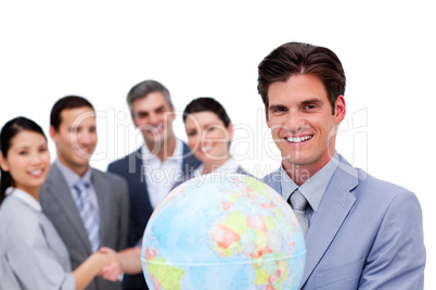 Successful manager and his team holding a terrestrial globe