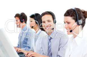 Confident customer service agents working in a call center