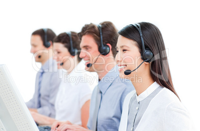 Cheerful customer service agents working in a call center