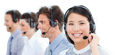 Portrait of smiling customer service agents working in a call ce