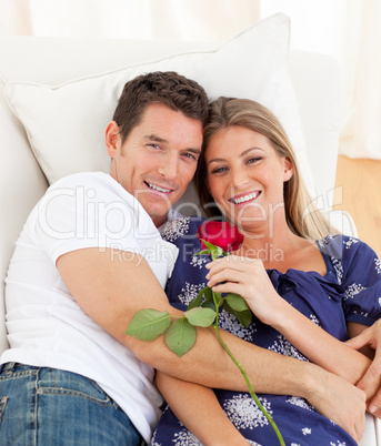 Romantic lovers relaxing on sofa