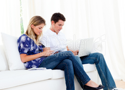 Young couple working at home