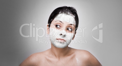 Cosmetician make mask to girl. Facial massage.