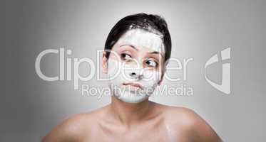 Cosmetician make mask to girl. Facial massage.