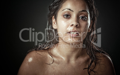 Portrait of beautiful young woman with wet face