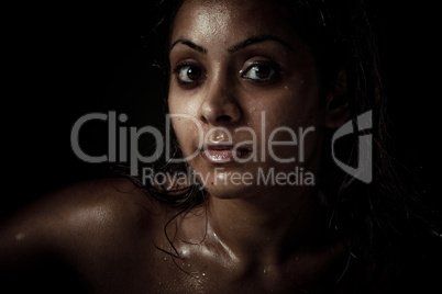 Portrait of beautiful young woman with wet face