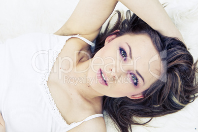 Young woman laying bed