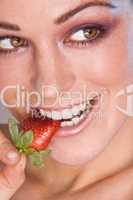 Image of beautiful girl holding strawberry
