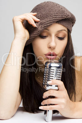 Sexy woman singing in retro mic