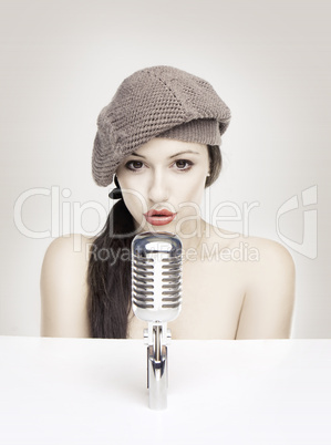 Sexy woman singing in retro mic