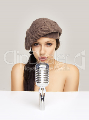 Sexy woman singing in retro mic