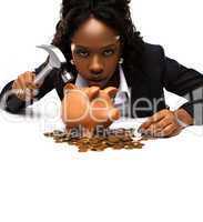 beautiful african american woman with a piggybank