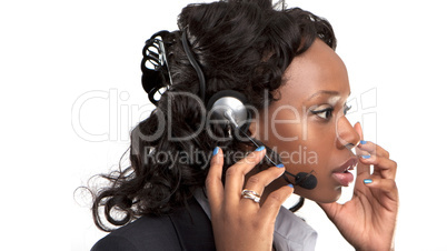 smiling businesswoman talking on a customer service telephone headset.