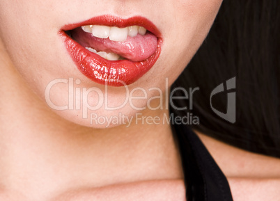 Beautiful woman leaking teeth with tongue