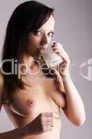 nude girl with glass of milk