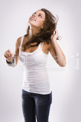 isolated nice woman on jeans and white tanktop