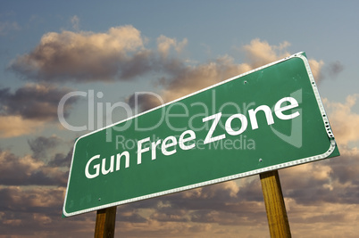 Gun Free Zone Green Road Sign and Clouds