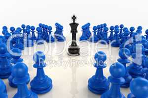 Black chess king surrounded by blue pawns