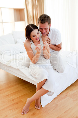 Happy couple finding out results of a pregnancy test