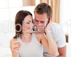 Cheerful couple finding out results of a pregnancy test