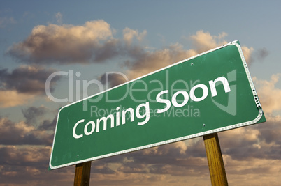 Coming Soon Green Road Sign Over Clouds