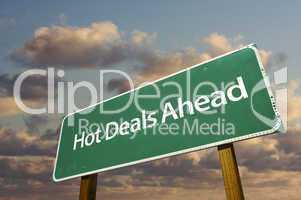 Hot Deals Ahead Green Road Sign Over Clouds