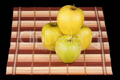 Four yellow apples