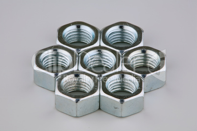 Seven metal nuts