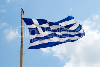 Waving flag of Greece against the blue sky