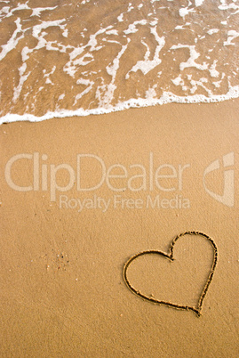 heart simbol on the sand