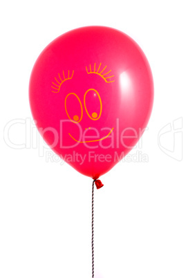 Red balloon with smile on white background