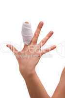White medicine bandage on human injury hand finger. Studio isola