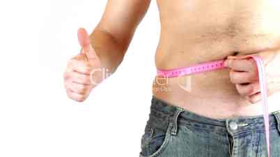 Man measuring his big belly showing ok sign