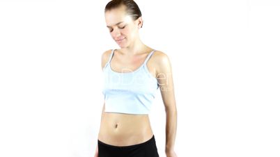 Unhappy young woman measuring her belly