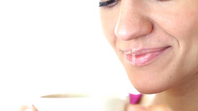 Closeup of woman drinking tea