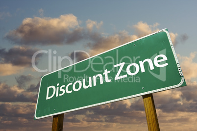 Discount Zone Green Road Sign and Clouds