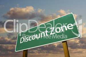 Discount Zone Green Road Sign and Clouds