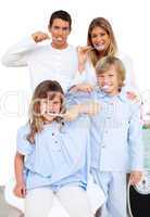 Jolly family brushing their teeth