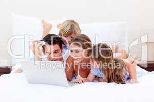 Animated family buying online lying down on bed