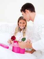 Attractive husband giving a present to his wife