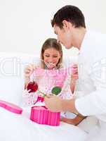 Charming husband giving a present to his wife